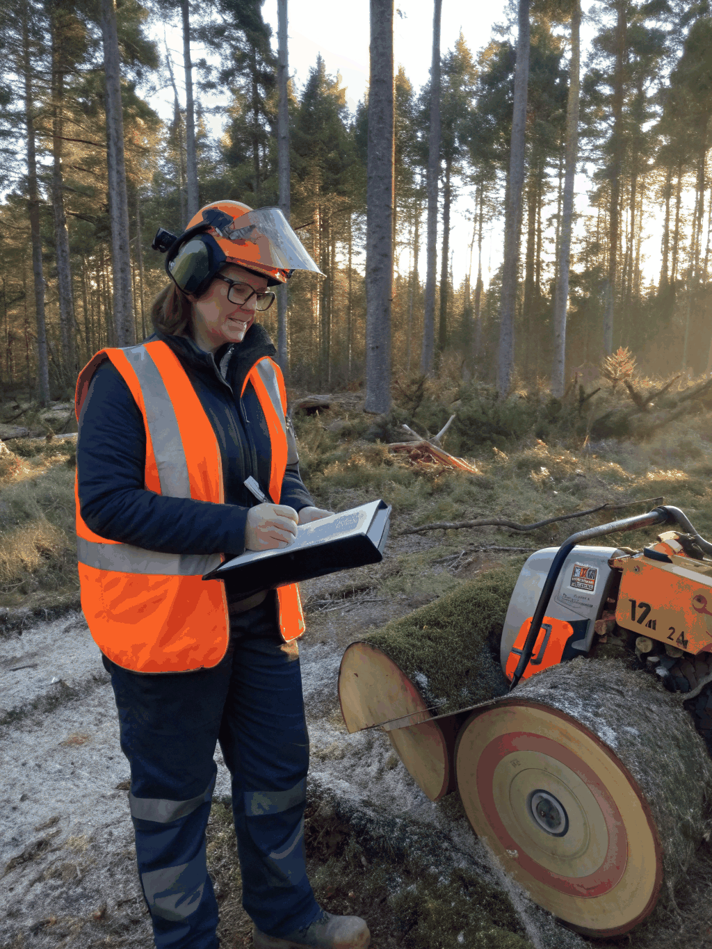 Elena Vance, lead designer, reviewing landscape plans on a site visit